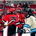 Ice Dawgs defenseman Truman Haugen celebrates a goal with 3 teammates