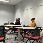 Athens-Clarke County Commission members sit in a meeting room during a Human Relations Commission