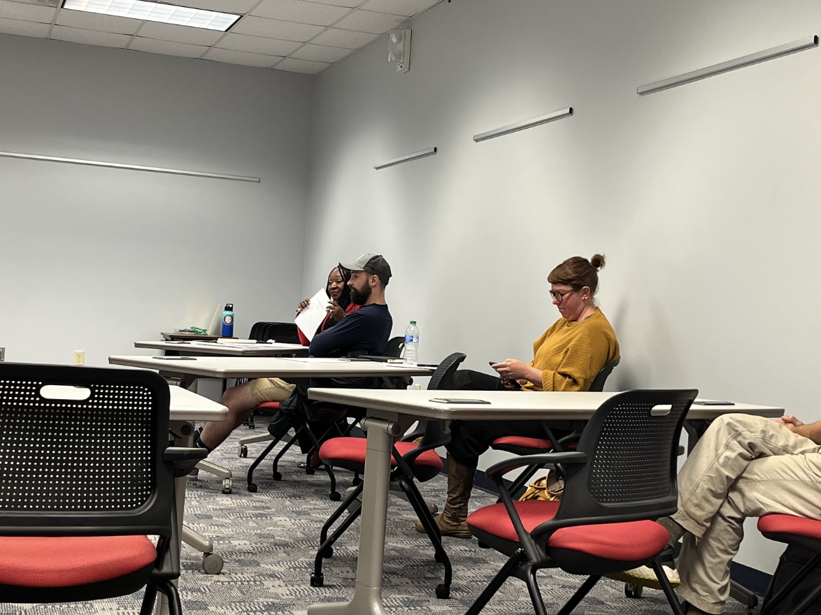 Athens-Clarke County Commission members sit in a meeting room during a Human Relations Commission